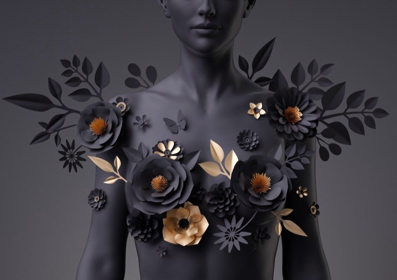Escultura digital de flores de papel pretas e douradas sobre um torso escuro